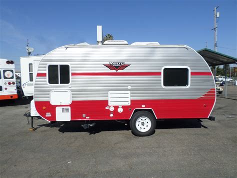 Front has a jiffy sofa that becomes the sleeping area, and the kitchen is in the back under the fold up door. . Riverside retro rv for sale